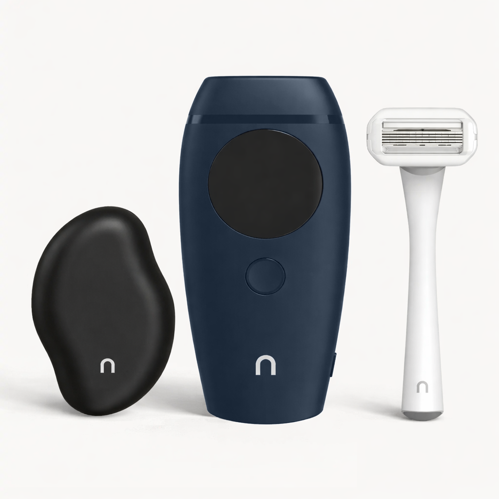 ood Tool Kit in navy blue including black Eraser exfoliating tool, Flasher 2.0 IPL device in navy, and white razor on light background